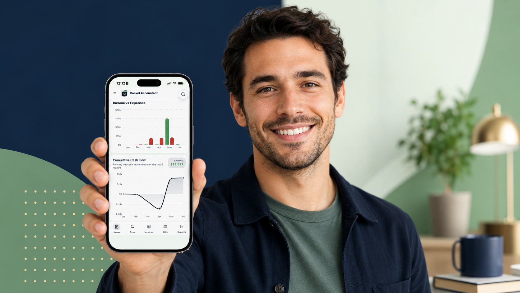 Smiling man holding smartphone displaying a financial analysis app.